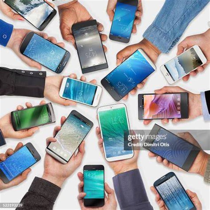 Hands holding phone - Getty